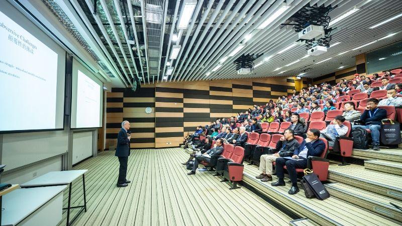 speaker in front of a hall of audience - planning a business events -plan successful Year-end event for your business