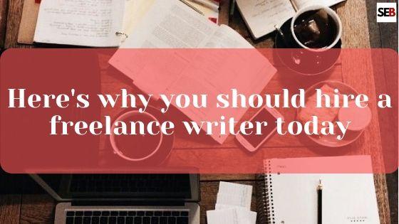 hire a freelance writer, coffee cup. open laptop, pen on a blank book, open books spread on a table