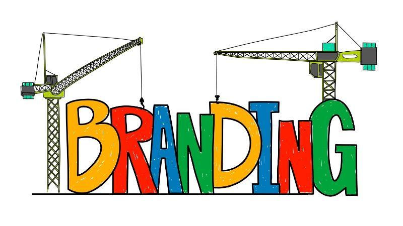 How do you build your brand without breaking the bank - multi-colored branding letters with cranes building it