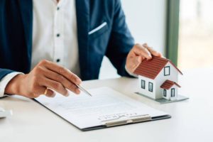 The real estate agent is going through a property insurance policy